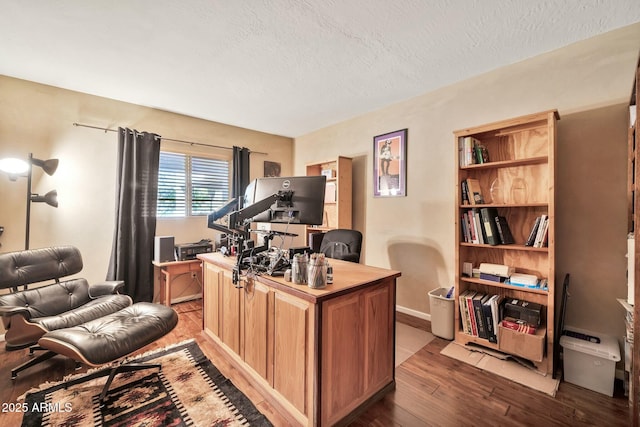 office featuring a textured ceiling and wood finished floors