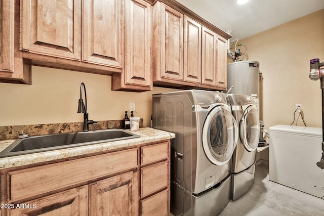 laundry room with cabinet space, independent washer and dryer, water heater, and a sink