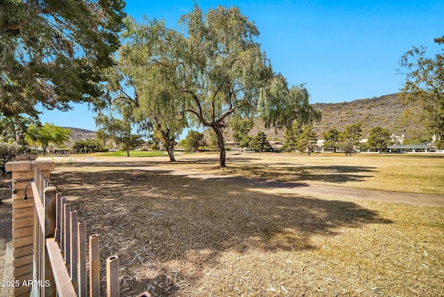 view of home's community featuring a yard and a mountain view