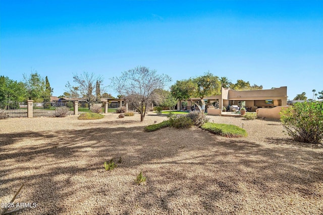 view of yard featuring a patio and fence