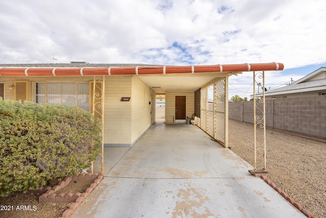 exterior space with a carport