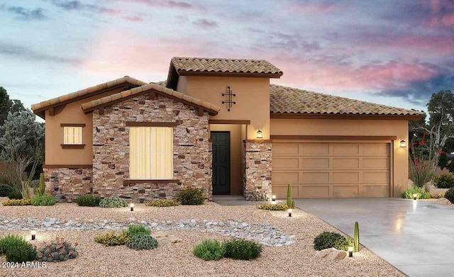 mediterranean / spanish house featuring a garage