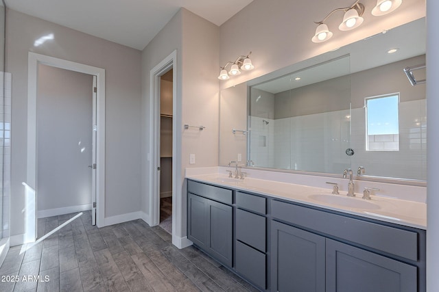 bathroom with vanity and a shower with shower door