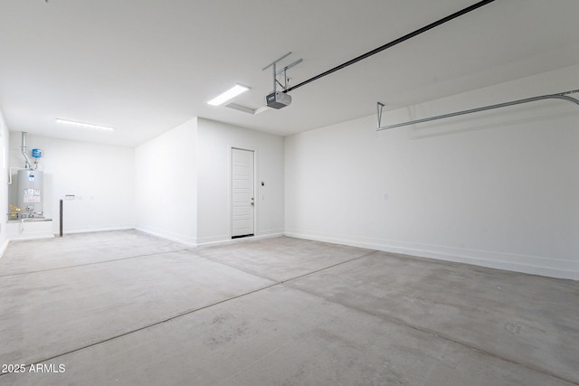 garage featuring a garage door opener and water heater