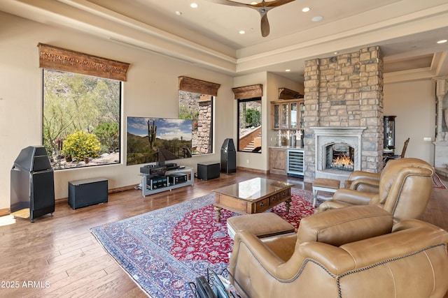 11550 E Paradise Ln, Scottsdale, AZ 85255 - living area featuring a ceiling fan, recessed lighting, wood finished floors, baseboards, and a stone fireplace