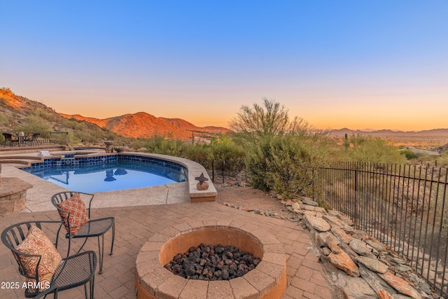 11550 E Paradise Ln, Scottsdale, AZ 85255 - view of pool featuring a fire pit, a patio area, a mountain view, and a pool with connected hot tub