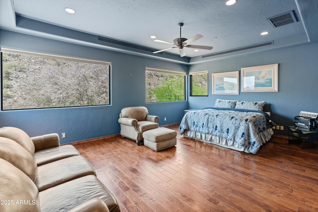 11550 E Paradise Ln, Scottsdale, AZ 85255 - bedroom featuring a tray ceiling, wood-type flooring, recessed lighting, baseboards, and a ceiling fan
