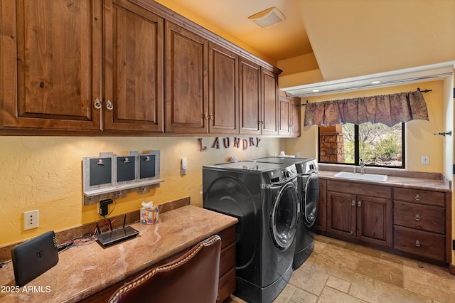 11550 E Paradise Ln, Scottsdale, AZ 85255 - washroom with cabinet space, separate washer and dryer, and stone tile flooring