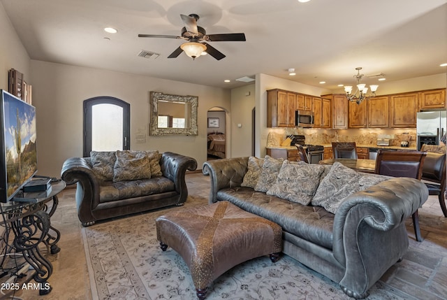 11550 E Paradise Ln, Scottsdale, AZ 85255 - living area with arched walkways, a chandelier, recessed lighting, and ceiling fan