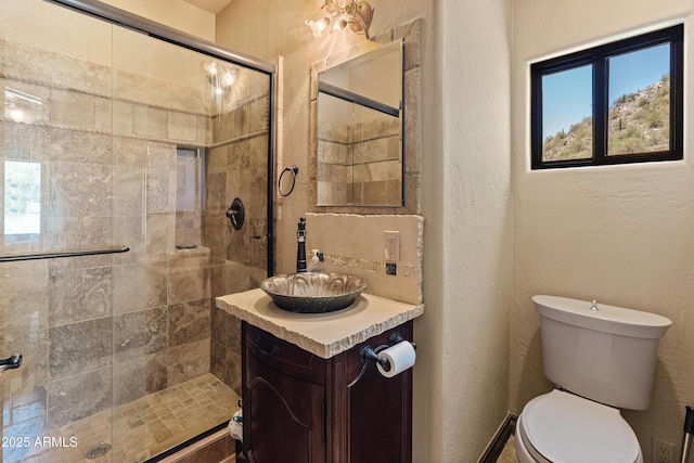 11550 E Paradise Ln, Scottsdale, AZ 85255 - full bathroom with a stall shower, vanity, toilet, and a textured wall