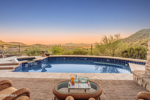 11550 E Paradise Ln, Scottsdale, AZ 85255 - view of pool featuring a mountain view, a pool with connected hot tub, and a patio area