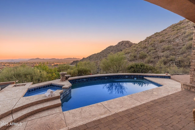 11550 E Paradise Ln, Scottsdale, AZ 85255 - view of pool featuring a mountain view, a patio, and a pool with connected hot tub