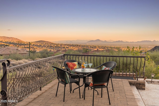 11550 E Paradise Ln, Scottsdale, AZ 85255 - patio terrace at dusk featuring a mountain view