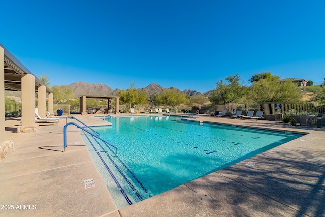 11550 E Paradise Ln, Scottsdale, AZ 85255 - community pool with a mountain view and a patio area