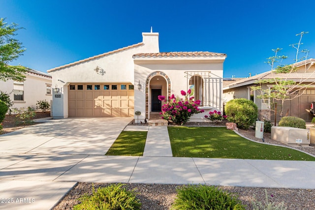 20784 W Minnezona Ave, Buckeye, AZ 85396 - mediterranean / spanish-style house with a tile roof, stucco siding, an attached garage, concrete driveway, and a chimney