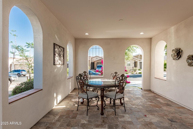 20784 W Minnezona Ave, Buckeye, AZ 85396 - dining room featuring stone tile floors, recessed lighting, and baseboards