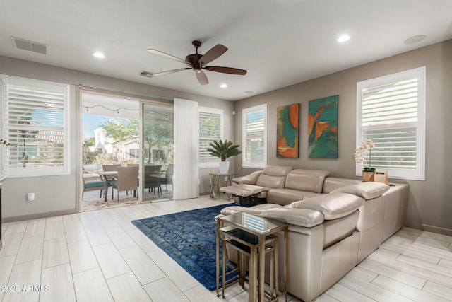 20784 W Minnezona Ave, Buckeye, AZ 85396 - living room with ceiling fan, baseboards, and recessed lighting