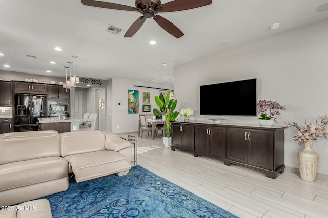 20784 W Minnezona Ave, Buckeye, AZ 85396 - living area with recessed lighting, a ceiling fan, and baseboards