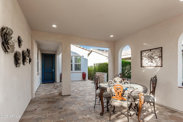 20784 W Minnezona Ave, Buckeye, AZ 85396 - dining space featuring stone tile flooring, plenty of natural light, and recessed lighting