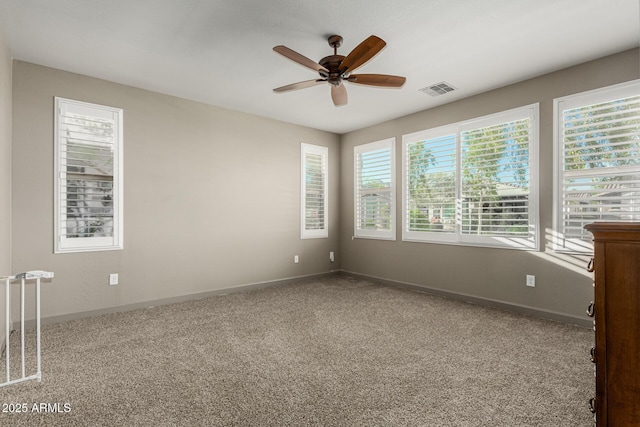 20784 W Minnezona Ave, Buckeye, AZ 85396 - empty room with a ceiling fan, carpet, and baseboards