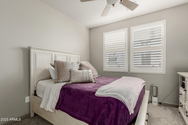 20784 W Minnezona Ave, Buckeye, AZ 85396 - bedroom featuring light colored carpet, multiple windows, baseboards, and a ceiling fan