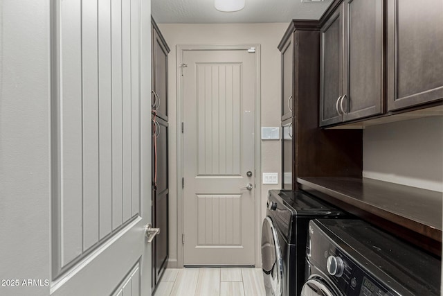20784 W Minnezona Ave, Buckeye, AZ 85396 - laundry room featuring cabinet space and separate washer and dryer
