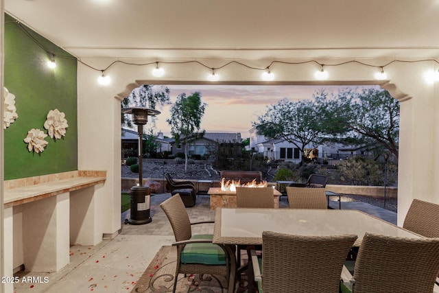20784 W Minnezona Ave, Buckeye, AZ 85396 - view of patio / terrace with an outdoor fire pit and outdoor dining space
