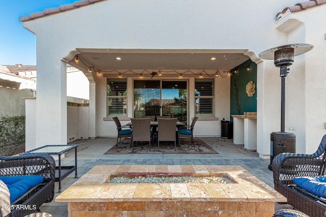 20784 W Minnezona Ave, Buckeye, AZ 85396 - view of patio / terrace with an outdoor fire pit and outdoor dining area