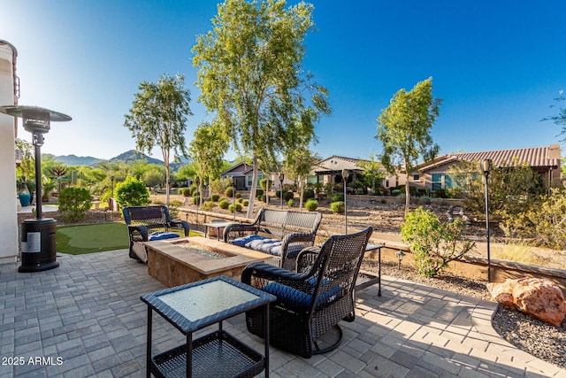 20784 W Minnezona Ave, Buckeye, AZ 85396 - view of patio with a putting green and a fire pit