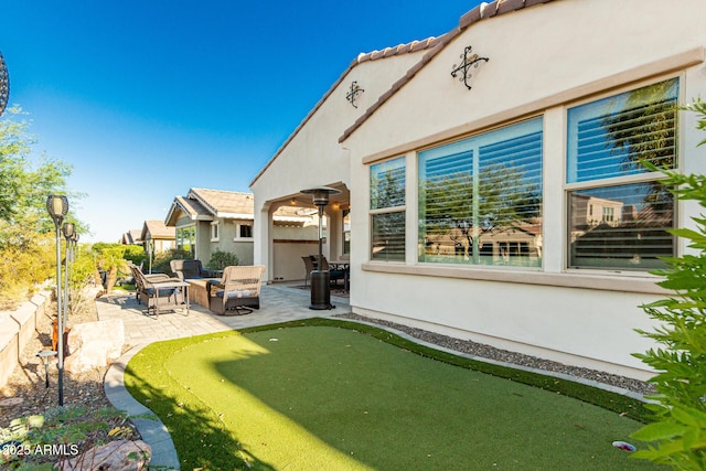 20784 W Minnezona Ave, Buckeye, AZ 85396 - view of yard featuring a putting green and a patio