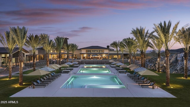 20784 W Minnezona Ave, Buckeye, AZ 85396 - community pool with a community hot tub, a patio, and a lawn