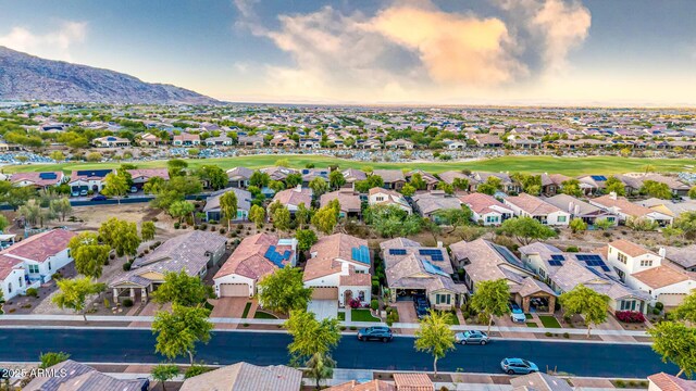 20784 W Minnezona Ave, Buckeye, AZ 85396 - aerial view of residential area featuring a local golf course and a mountainous background
