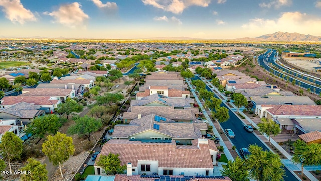 20784 W Minnezona Ave, Buckeye, AZ 85396 - aerial perspective of suburban area with a mountainous background