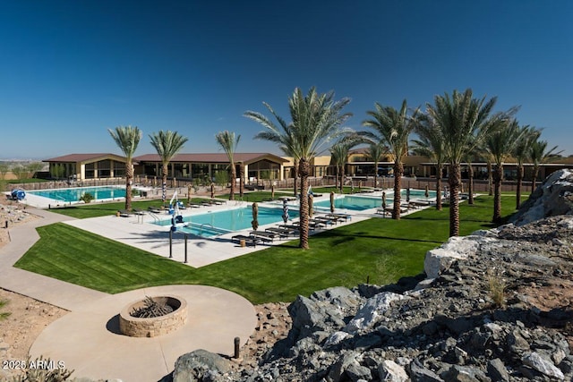 20784 W Minnezona Ave, Buckeye, AZ 85396 - community pool with a fire pit and a patio area