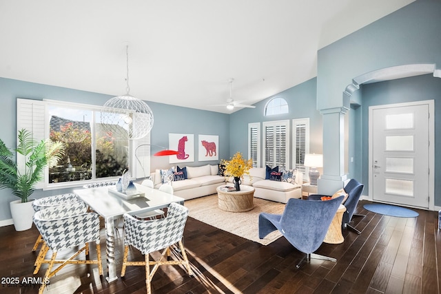 living room featuring high vaulted ceiling, dark hardwood / wood-style floors, and ceiling fan