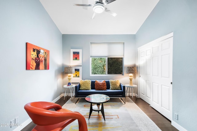 sitting room featuring ceiling fan and dark hardwood / wood-style flooring