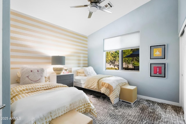 bedroom with dark colored carpet, lofted ceiling, and ceiling fan