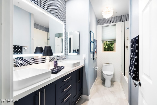 full bathroom with vanity, tub / shower combination, and toilet