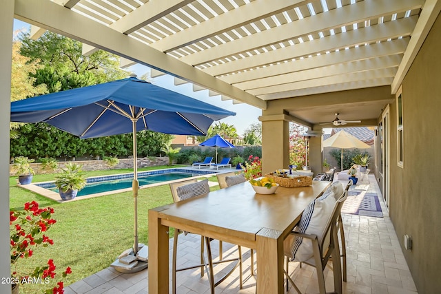 view of patio / terrace featuring ceiling fan and a pergola