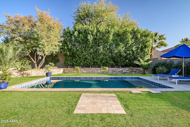 view of pool featuring a yard