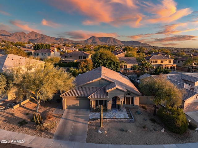 aerial view at dusk with a mountain view