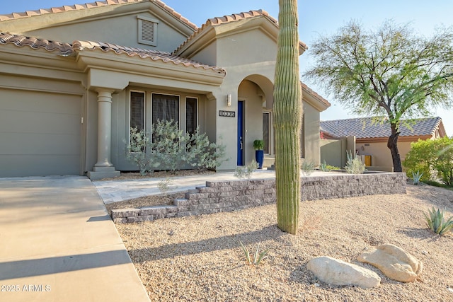 view of front of property with a garage