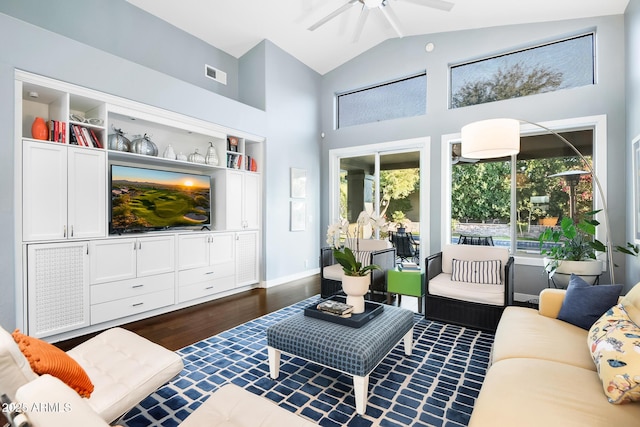 living room featuring ceiling fan, dark hardwood / wood-style flooring, and high vaulted ceiling