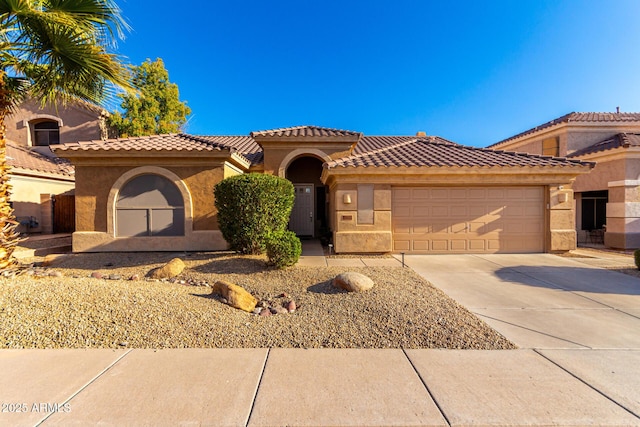 mediterranean / spanish-style home featuring a garage