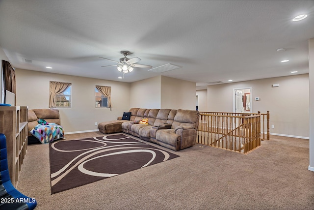 living room featuring ceiling fan and carpet