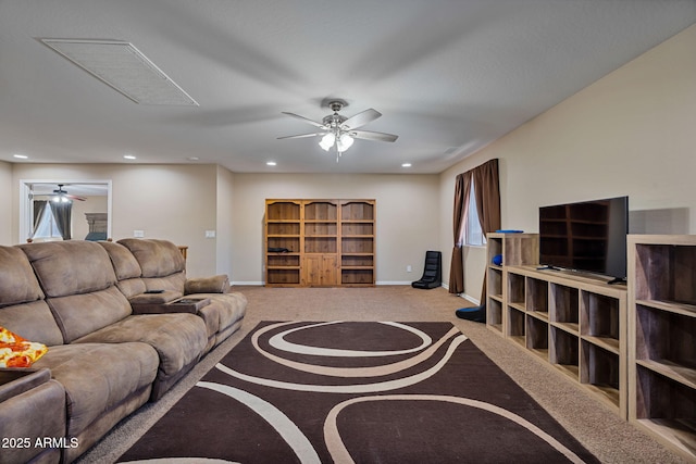 carpeted living room with ceiling fan