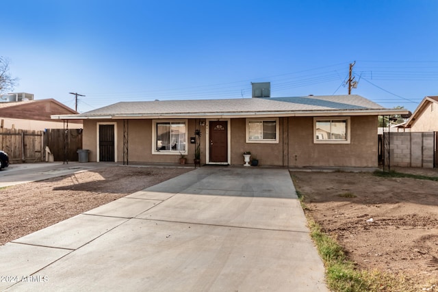 ranch-style house with central AC unit