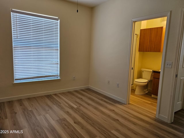 14250 W Wigwam Blvd Unit 1723, Litchfield Park, AZ 85340 - unfurnished bedroom with light wood-type flooring and ensuite bath