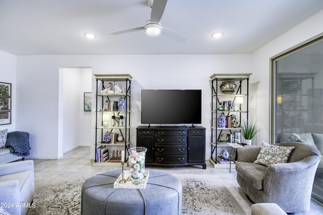 living room featuring ceiling fan and light tile patterned floors