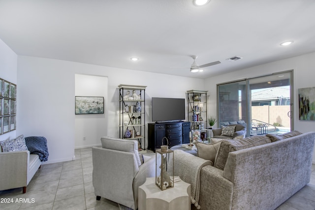 living room featuring light tile patterned floors and ceiling fan